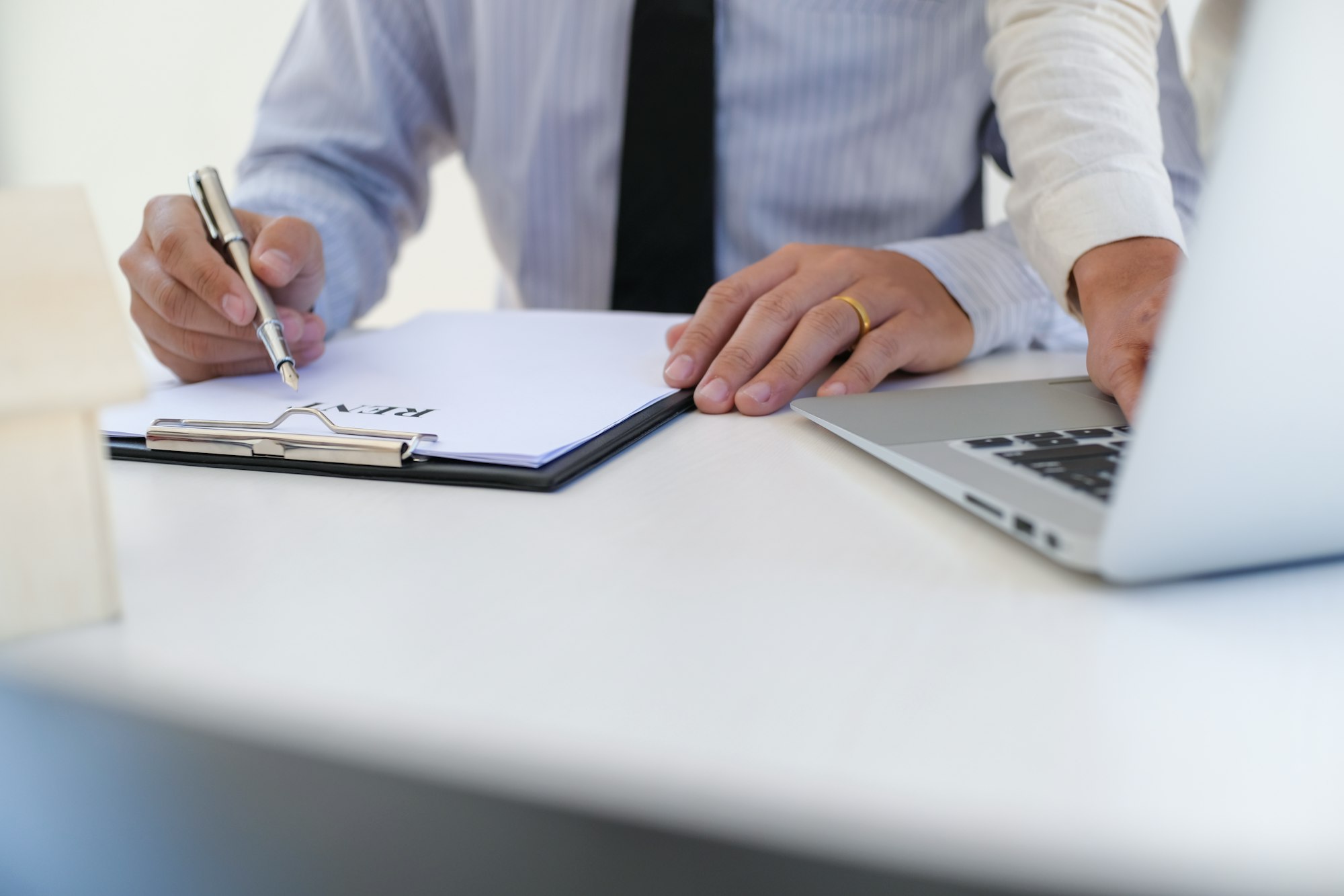 Sales manager giving advice application form document, considering mortgage